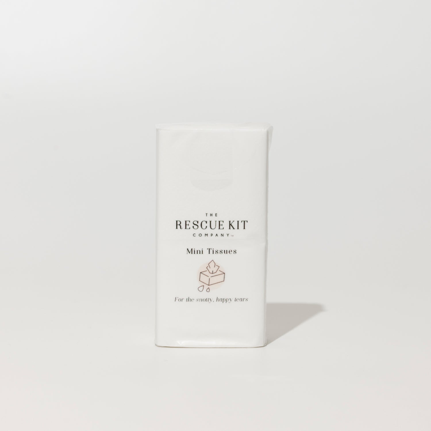 The Rescue Kit Company Mini Tissue pack, featuring elegant white packaging with a soft blush icon and the phrase “For the snotty, happy tears” printed below.