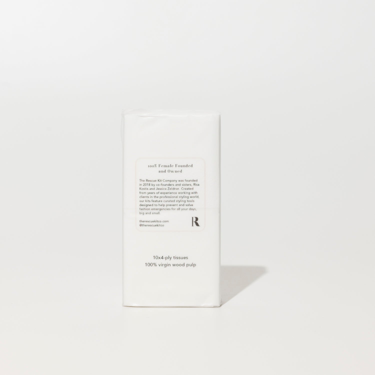 Back of The Rescue Kit Company Mini Tissue pack showing brand story, founder details, and product info—labeled 100% female founded and made with virgin wood pulp.