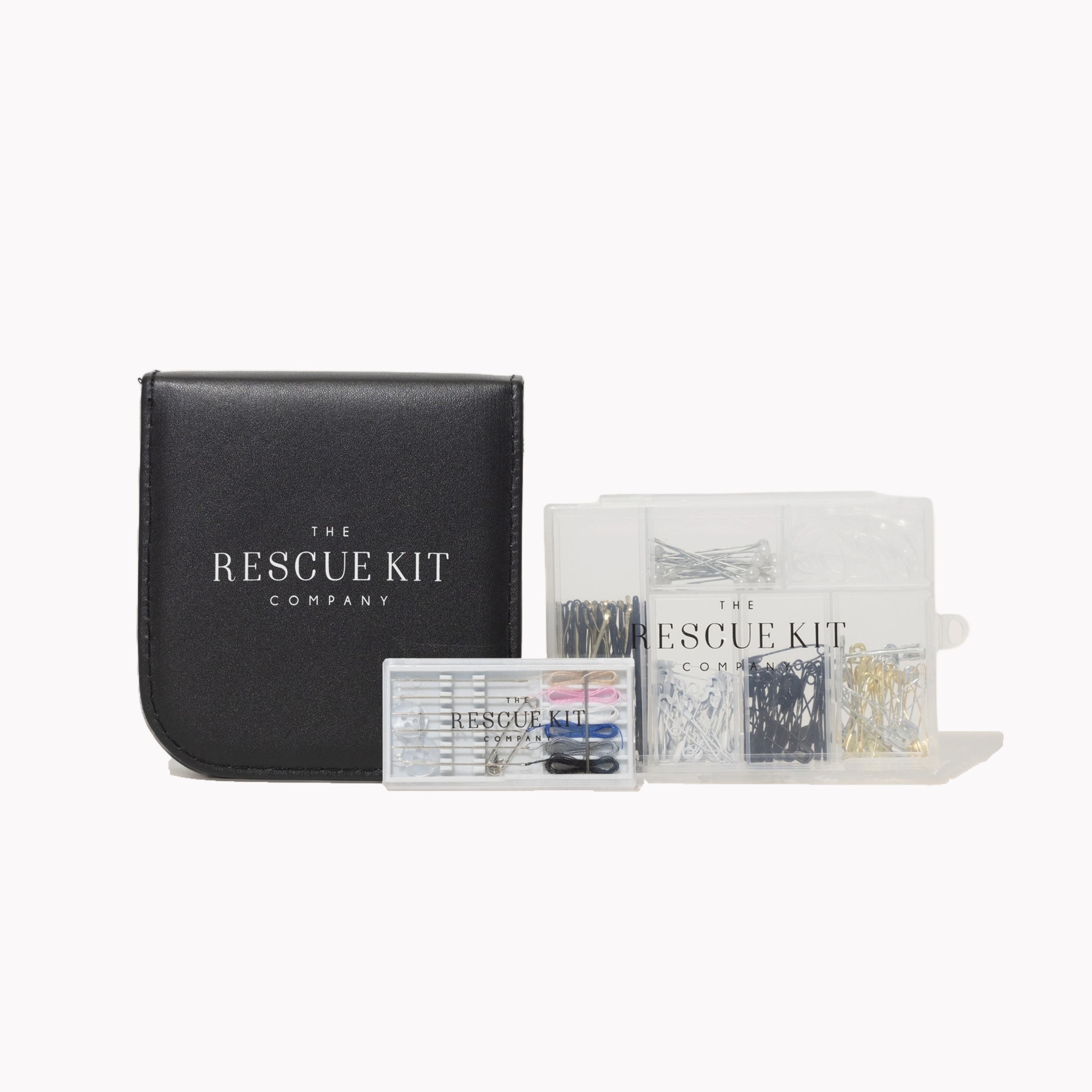 Black leather travel sewing kit with 'The Rescue Kit Company' branding, Hair + Pin Kit, and pre threaded needles.