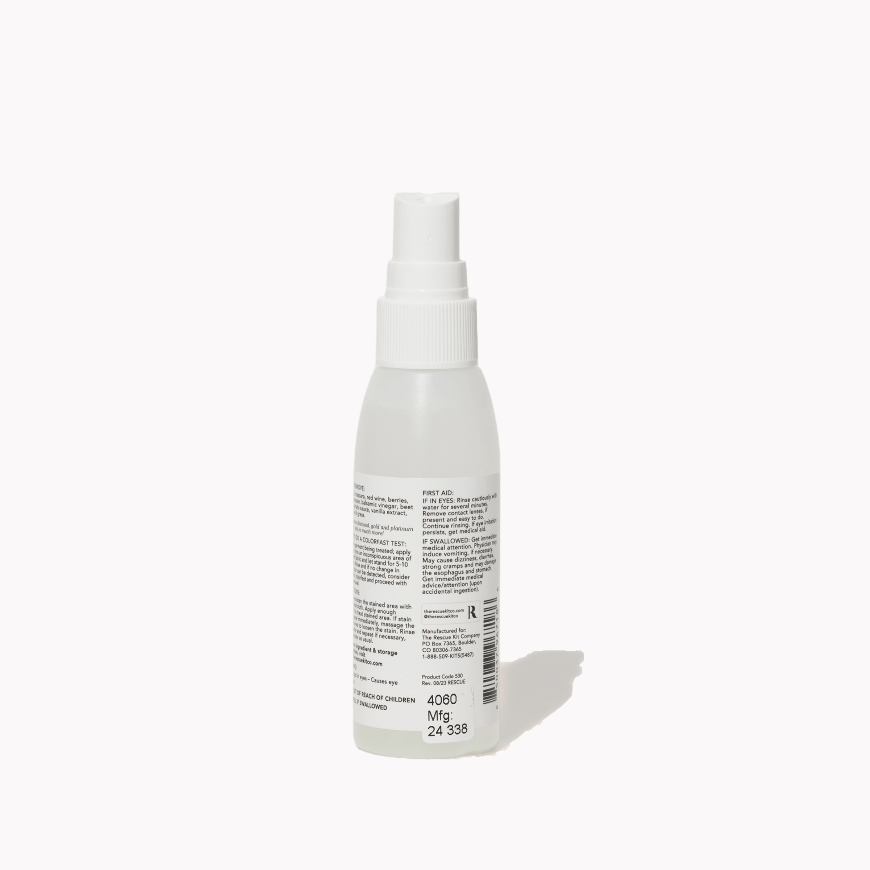 White spray bottle with label on a white background