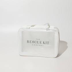 White Rescue Kit Company carry bag with handles and clear front panel featuring the brand logo, designed to hold fashion emergency and styling essentials.