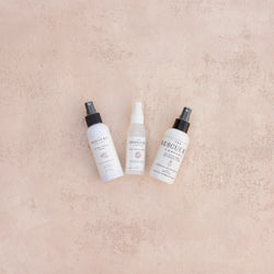 The Essential Spray Trio by The Rescue Kit Company containing wrinkle release spray, stain removing spray, and anti-static spray for wedding attire.