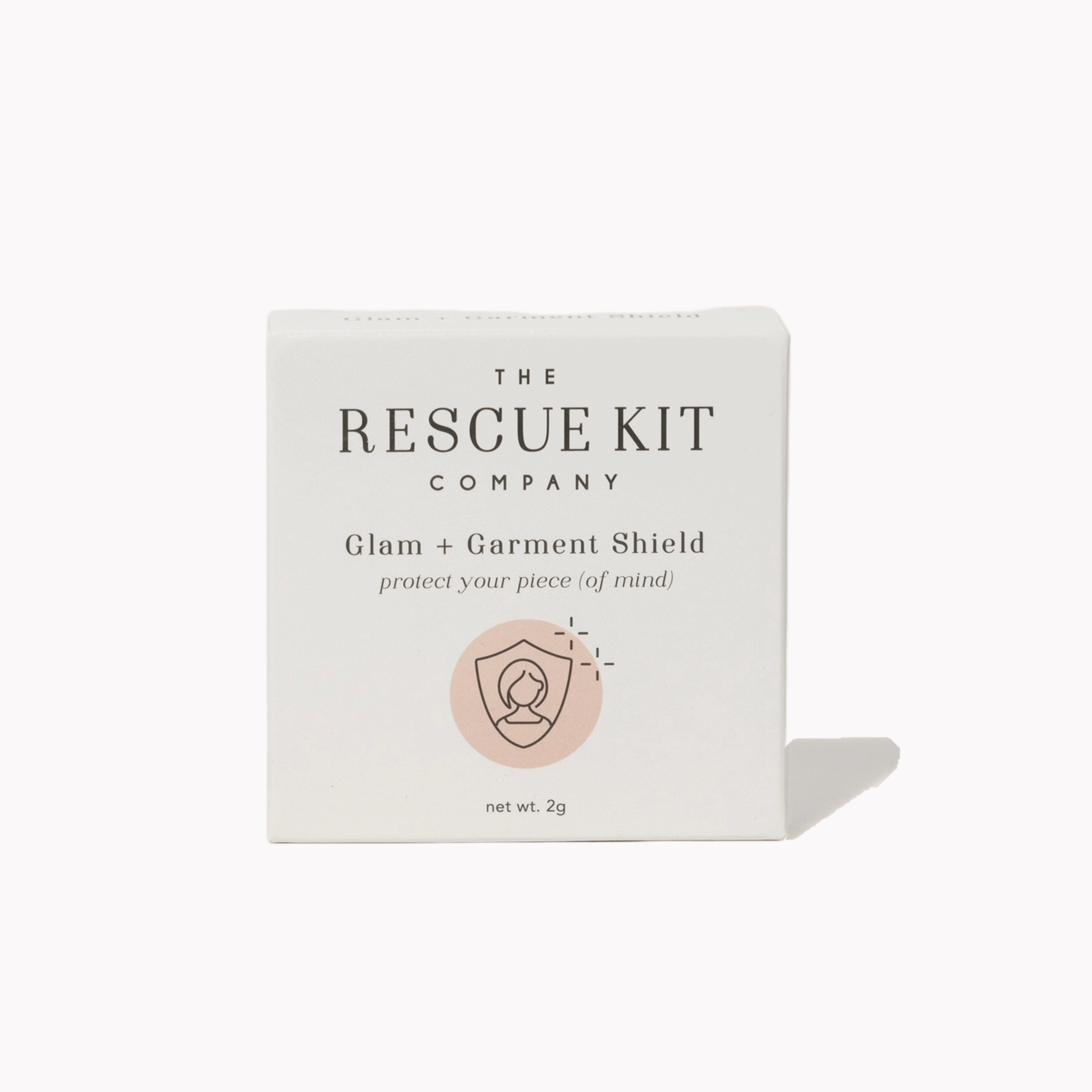 Exterior box of the Glam + Garment Shield by The Rescue Kit Company. White box, pink icon.