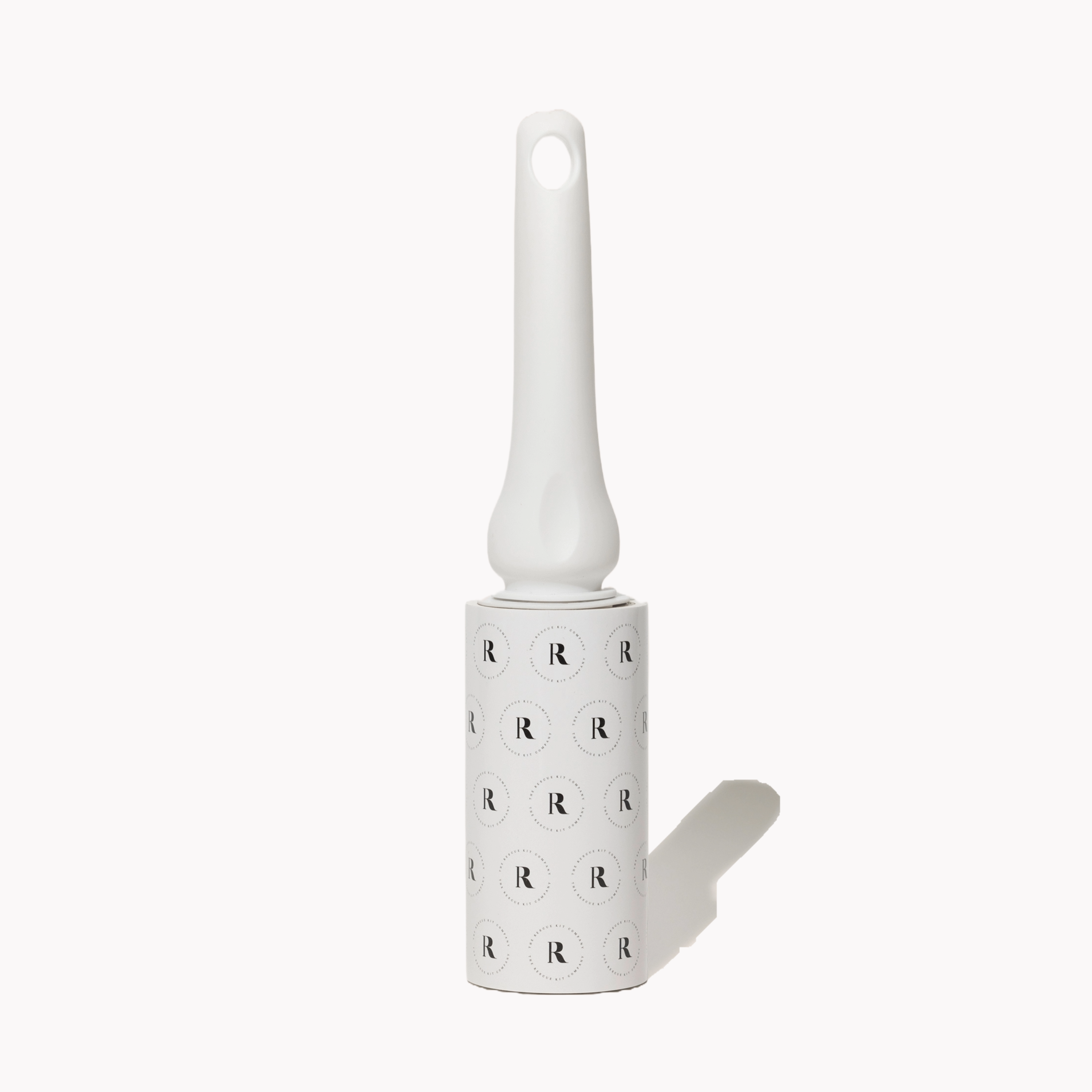 White lint roller by The Rescue Kit Company with logo protective liner shown. Standing up.