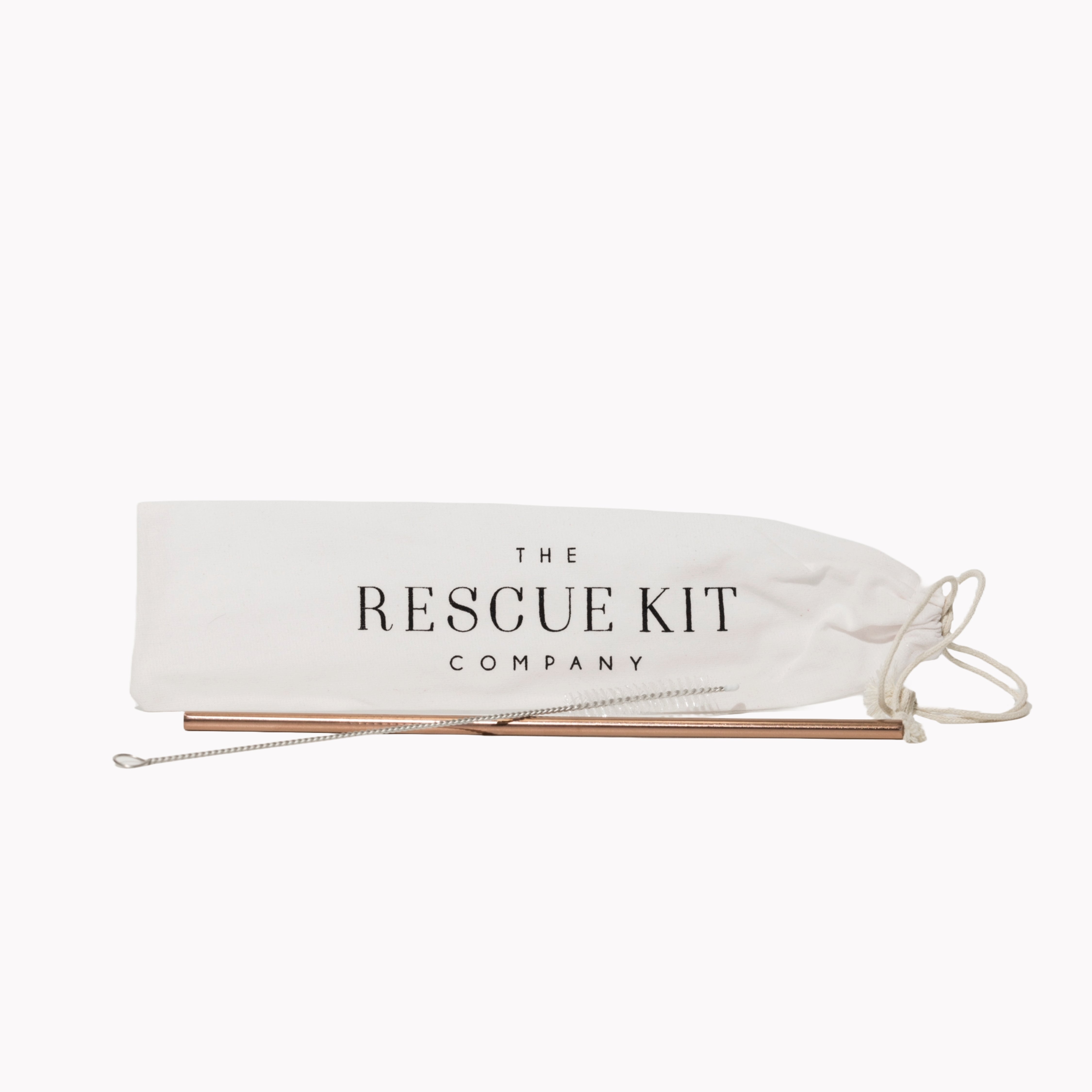 Reusable rose gold metal straw with cleaning brush, displayed in front of a white drawstring pouch featuring The Rescue Kit Company logo.