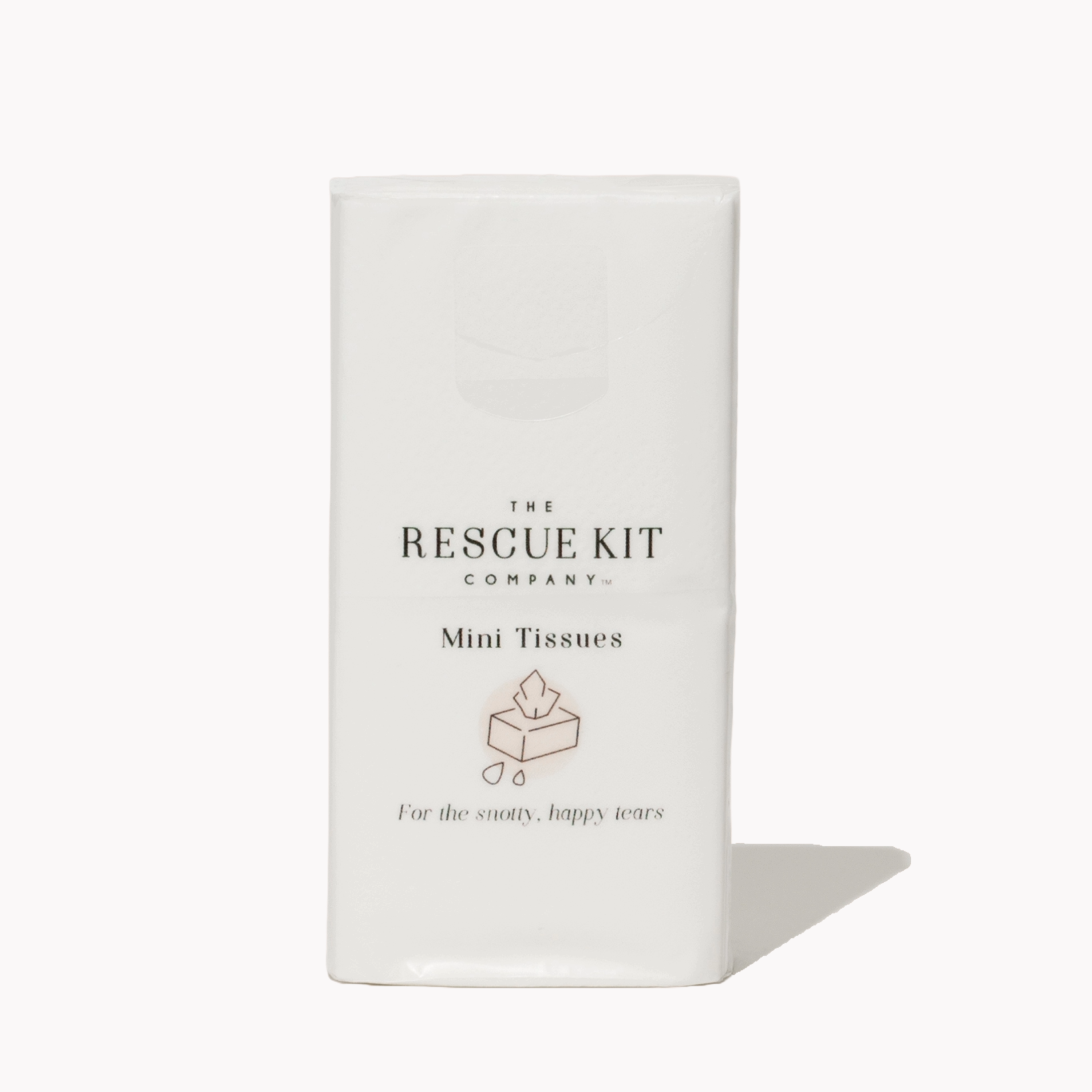 The Rescue Kit Company Mini Tissue pack, featuring elegant white packaging with a soft blush icon and the phrase “For the snotty, happy tears” printed below.