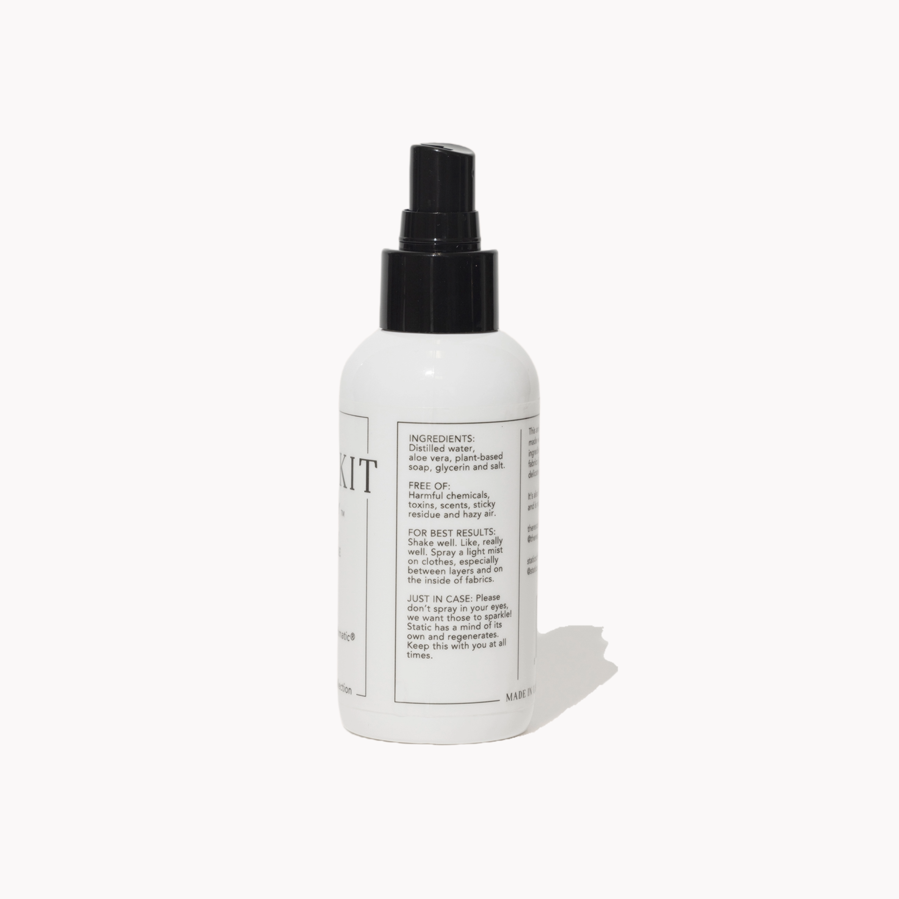 White anti-static spray bottle with black nozzle on a white background