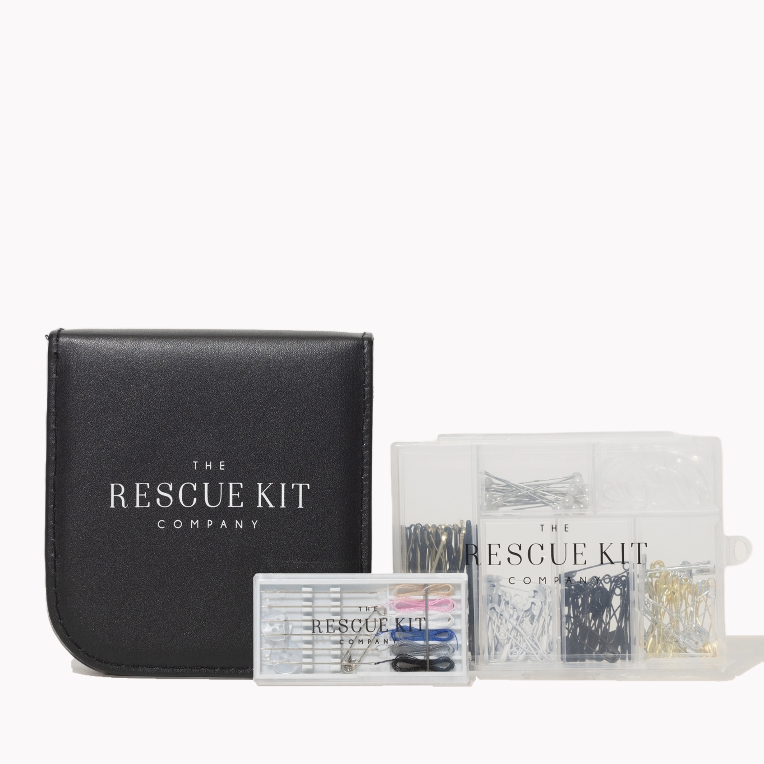 Trio of sewing based styling tools by The Rescue Kit Company. From Left to right: black travel sewing kit, pre-threaded needles with wedding color thread, and The Hair + Pin Kit- a clear box with hair and pin items inside.