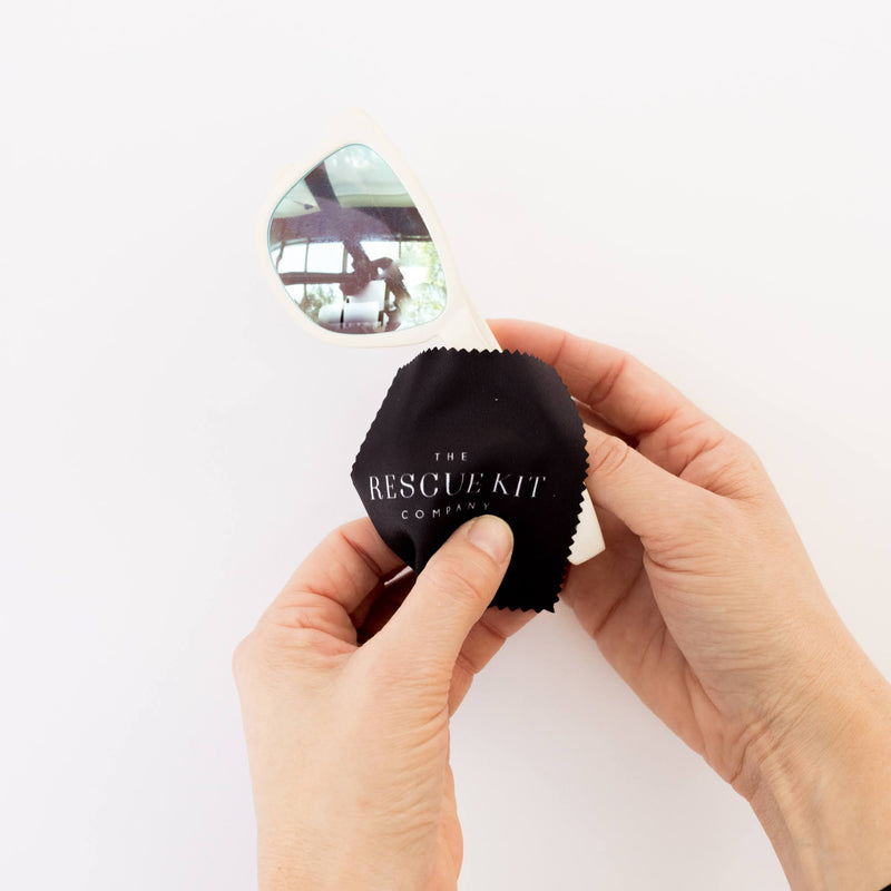 Pocket sized black lens cloth with white logo. Designed to fit discreetly in the purse of bridesmaids or pocket of groomsmen for quick lens cleaning during wedding festivities.